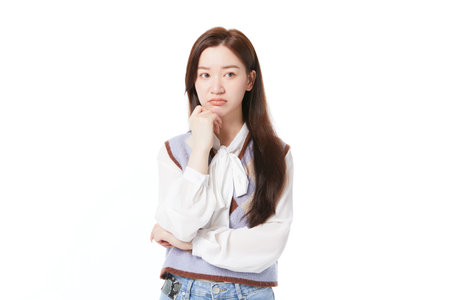 Working woman with puzzled expression and thinking about troublesの写真素材