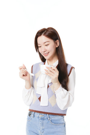 woman relaxing while drinking coffeeの写真素材