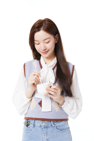 woman relaxing while drinking coffeeの写真素材