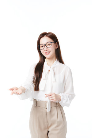 Teacher stretches out hand and invites students to answer questionsの写真素材