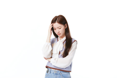 Working woman with puzzled expression and thinking about troublesの写真素材