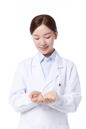 doctor holding hands on chestの写真素材