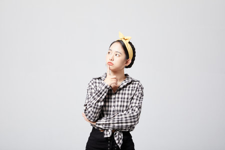 Energetic girl with puzzled expressionの写真素材