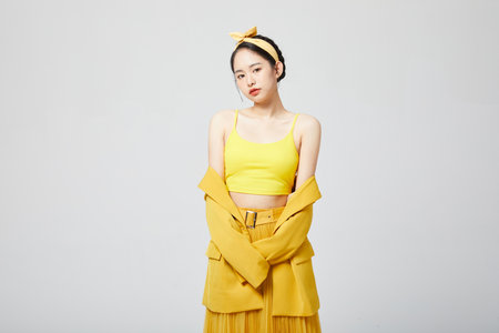 Vibrant fashion girl yellow dressの写真素材