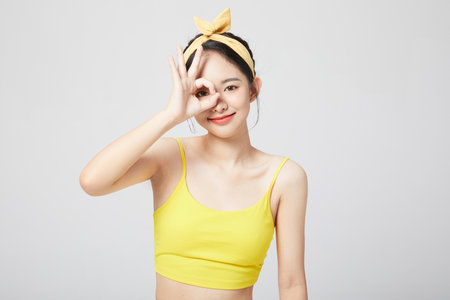 sweet and cute girl ok gestureの写真素材