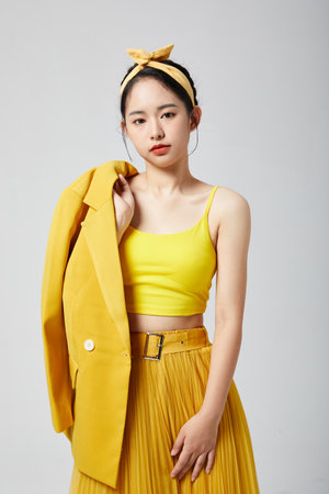 Stylish woman in yellow suitの写真素材