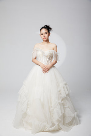Dignified elegant bride in wedding dress looking front cameraの写真素材
