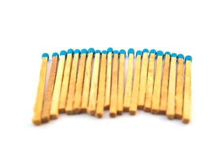 Blue matchsticks isolated on white backgroundの写真素材