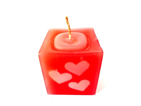 Red candle heart isolated on white backgroundの写真素材