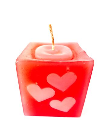 Red candle heart isolated on white backgroundの写真素材