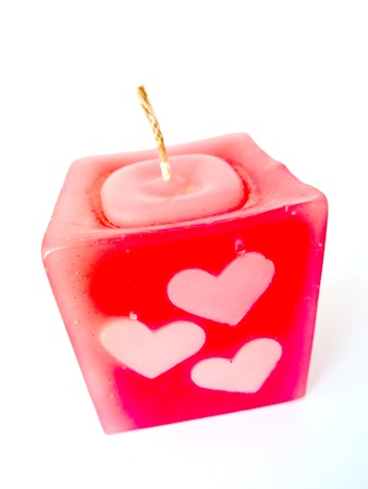 Red candle heart isolated on white backgroundの写真素材