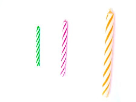 color Birthday Candles isolated on white backgroundの写真素材