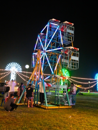 Small Ferris wheel at night in carnivalのeditorial素材