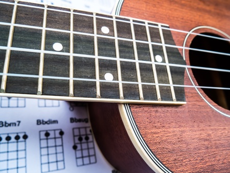 Brown color Ukulele and Paper Chordsの写真素材