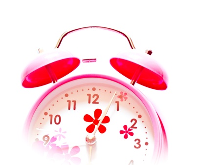 an pink alarm clock isolated on white backgroundの写真素材