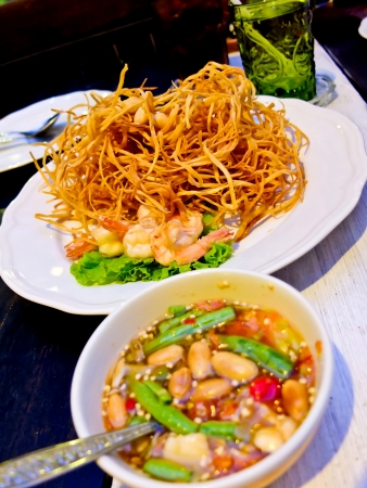 spicy fried papaya salad with shrimp by thai food styleの写真素材