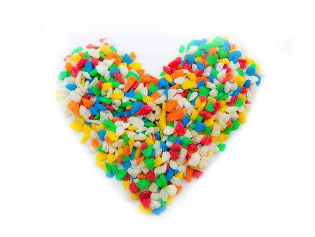 Colorful stone heart on white background is symbol of loveの写真素材