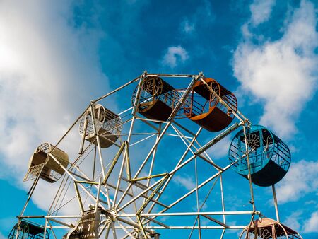 Vintage ferris wheel on blue skyの写真素材