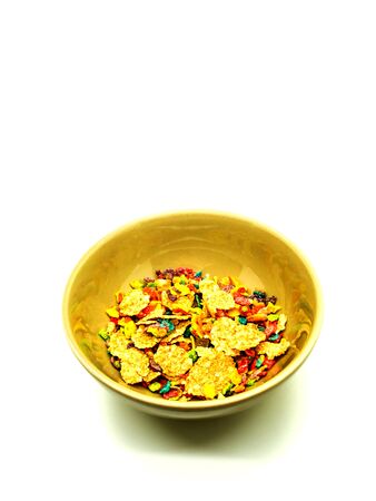colorful cereals in bowl on white backgroundの写真素材