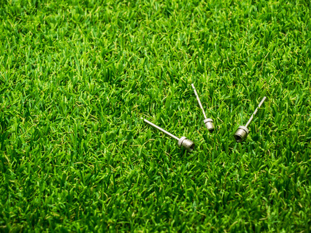 Metal inflation needle for inflatables and athletic balls on the grassの写真素材