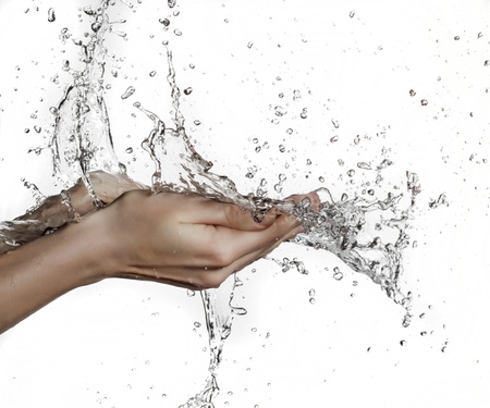 woman hand in water splashの写真素材