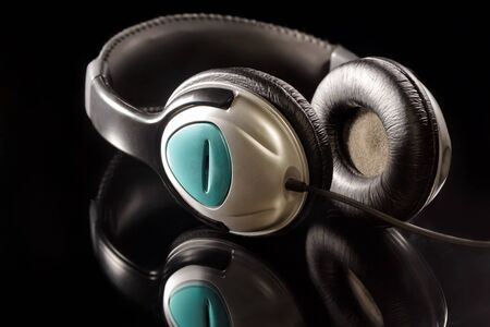 headphones on black mirror backgroundの写真素材