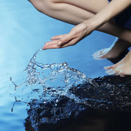 girl touch waterの写真素材