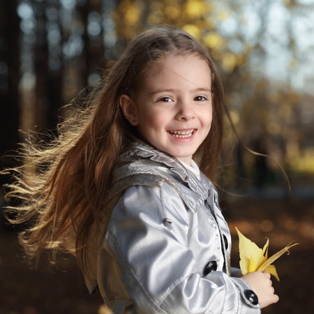 beauty girl in autumn parkの写真素材