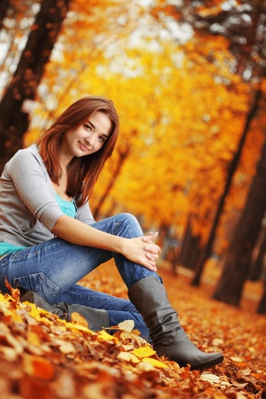beauty girl in autumn parkの写真素材