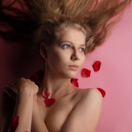 beauty girl in rose petalの写真素材