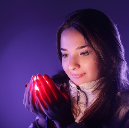 beauty woman with light in handの写真素材