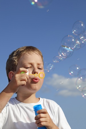 boy play in  bubblesの写真素材