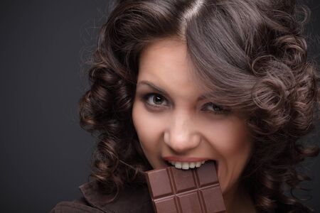 Beauty girl with chocolate bar