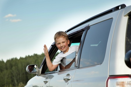 happy boy in car