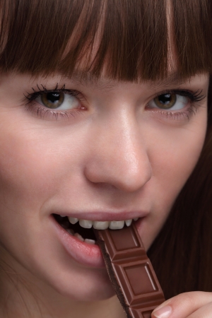 Beauty girl with chokolate barの写真素材