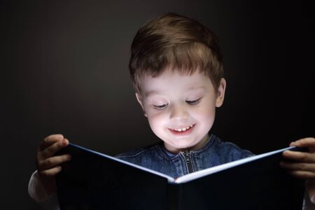 little boy read bookの写真素材