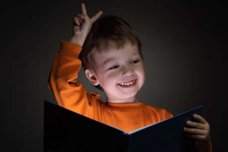 little boy read bookの写真素材