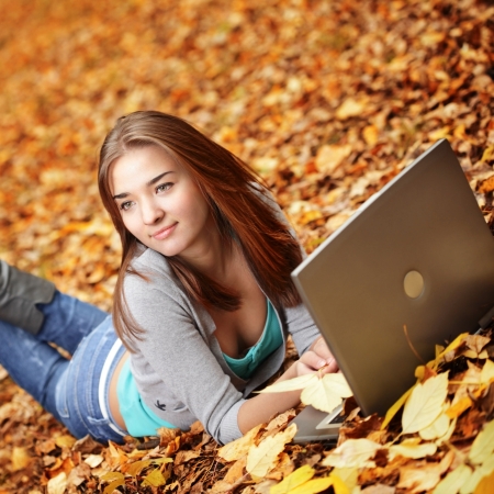 beauty girl in autumn parkの写真素材
