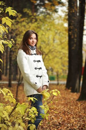 beauty girl in autumn parkの写真素材