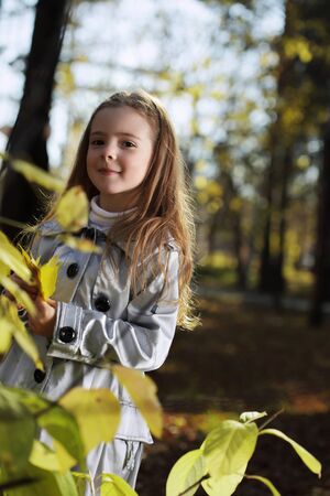 happy children in autumn parkの写真素材