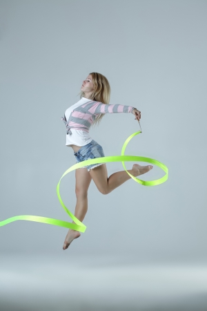 beauty girl dance on grey backgroundの写真素材