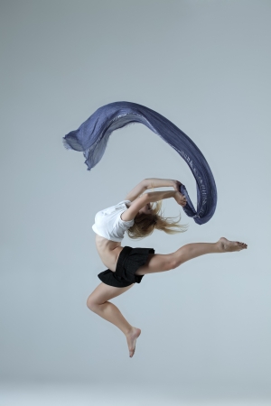 beauty girl dance on grey backgroundの写真素材