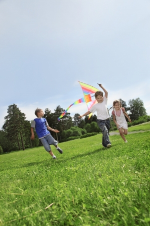 two happy boy with kiteの写真素材