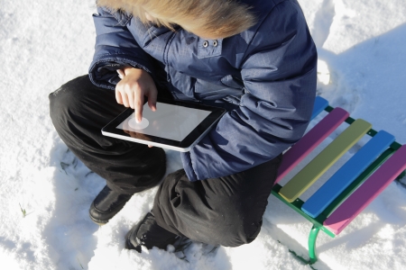 boy outdoors with tablet PCの写真素材