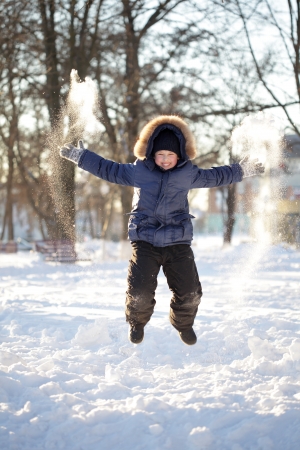 happy boy jump outdoorsの写真素材