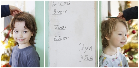 measure the growth of two boysの写真素材