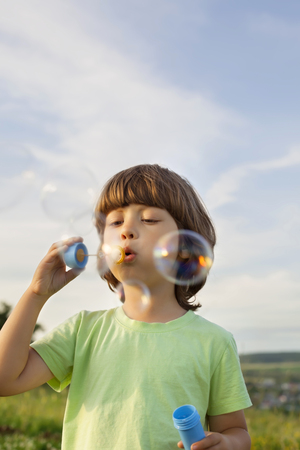 boy play in bubblesの写真素材
