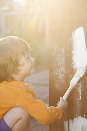 happy boy with paint brushの写真素材