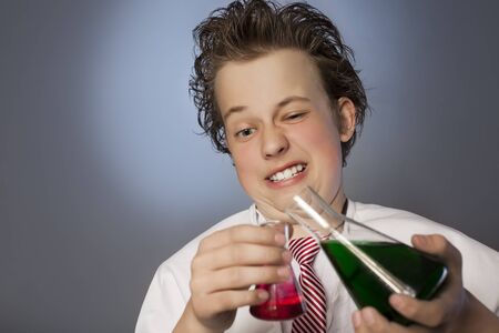 Funny emotional chemist with two flasksの写真素材