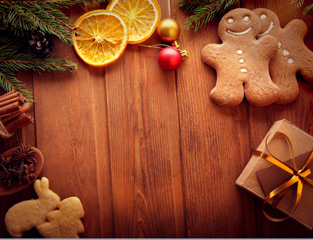 gingerbread Christmas tree and gifts on wooden tableの写真素材